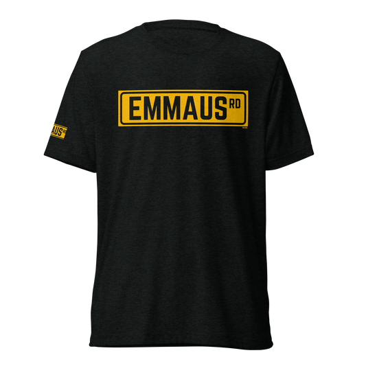 Terse Verse Christian Tee: Emmaus
Black t-shirt with bold yellow design/print on chest that reads "Emmaus" as a street sign.
Men's Tee / Unisex
Mockup of front.