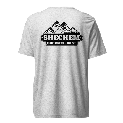 Terse Verse Christian Tee: Shechem
White t-shirt (with dark flecks) and a black design/print on back that reads "Shechem Gerizim-Ebal" and features mountains.
Men's Tee / Unisex
Mockup of back.